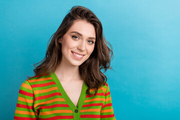 Fototapeta premium Closeup photo of young beautiful lady brown wavy hair wear striped trendy shirt good mood optimistic girlish isolated over blue background