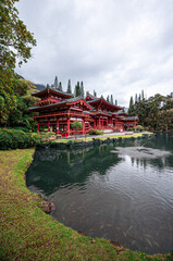 Red temple with pond