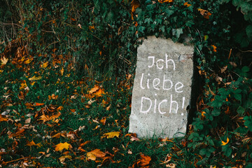 stone that says ich liebe dich, i love you in german graffiti 