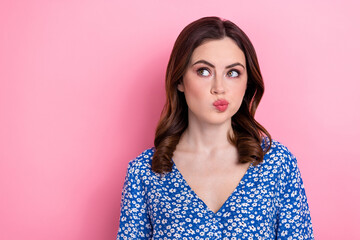 Fototapeta na wymiar Portrait of lovely creative lady look empty space pouted lips contemplate isolated on pink color background