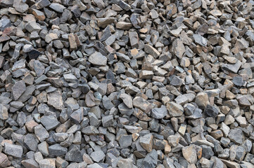 Large gravel as a background. Gray granite gravel background. Building stone. Banner design