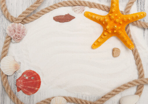 Abstract gray wooden nautical background with starfish, shells and rope