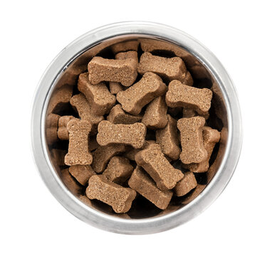 Metal bowl with dog food on a white background. View from above. Food for dogs and cats