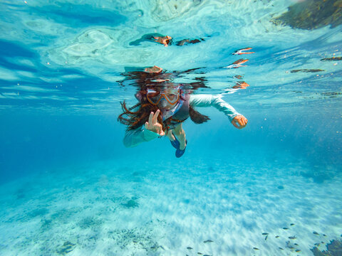 A girl snorkeling in Bonaire, Leeward Antilles