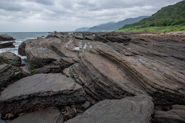 Fototapeta na wymiar layer rock landscape coast view in shimen Taiwan