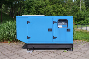 Electricity generator. Large, powerful blue stationary generator for electricity production