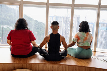 Fototapeta premium Group of friends meditating and doing yoga at home
