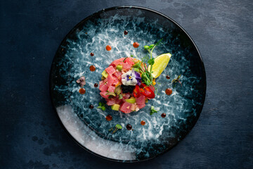 Tuna tartare with avocado, lime, pepper and flying fish caviar.