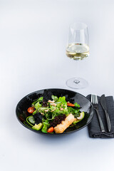 Green salad with avocado, fried feta, tomatoes, lettuce, cashew nuts and nori chips.