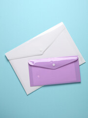 Plastic envelopes on a blue background