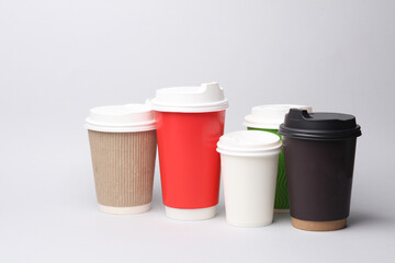 disposable cups for hot drinks on gray background