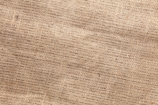 Brown Burlap texture close up. Textured fabric background