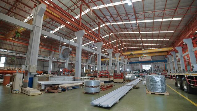 Large industrial buildings or factories with steel structures. Large industrial hall. Warehouse for storage and distribution products of metal sheet roof plant