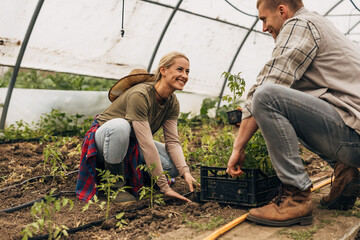 Two Caucasian young people gardening together.