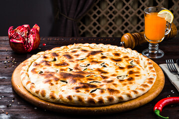 Georgian food khachapuri stuffed with minced meat, herbs and cheese.