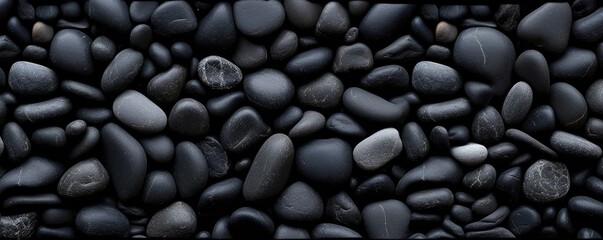 Fototapeta na wymiar a birds-eye view of Black river stones in a horizontal format for a product backdrop, Abtract-themed, photorealistic illustrations in JPG. Generative AI