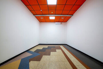 A fragment of the interior of an empty room with a red ceiling