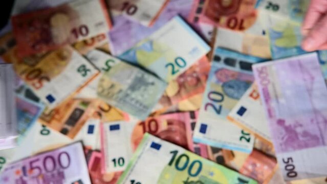 closeup female hands count paper 500 euro banknotes of european union, paper banknotes on table, concept of cash, payments, savings, banking, save up for vacation, car, winnings in a casino