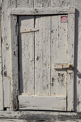 old wooden door with peeling paint 
