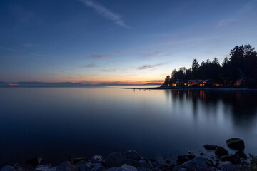 Naklejka na ściany i meble Roberts Creek at sunset, dusk or twilight on the Salish Sea, BC Canada travel and tourism