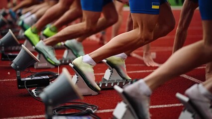 Low start of runners at the competition. Close-up - Powered by Adobe