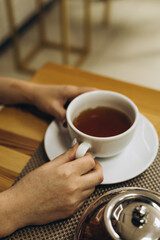 cup of tea with hands