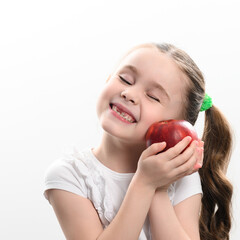 Red apple and little girl, portrait of a child on a white background