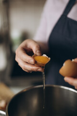 person preparing food in the kitchen eggs