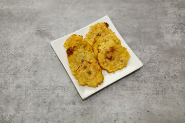 Fried and salted green plantains also known as tostones or patacones.