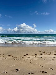 Fototapeta na wymiar ocean waves beach footprints