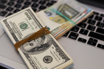 Financial risk, debt default concept : US USD dollar, laptop, silver handcuff.