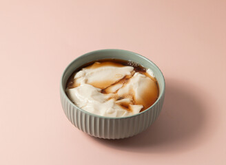 Fototapeta na wymiar Pure Bean Curd served in bowl isolated on background top view of taiwan food