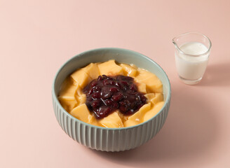 Red Bean Pudding served in bowl isolated on background top view of taiwan food