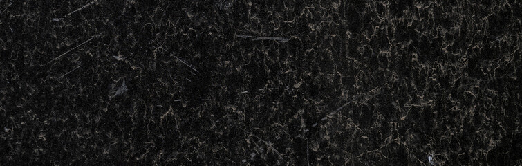 Black granite surface. Grunge stone texture. Basalt surface background