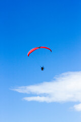 Paragliding in the blue sky