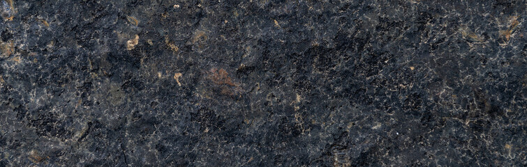 Close up of granite surface. Grunge stone texture. Basalt surface background