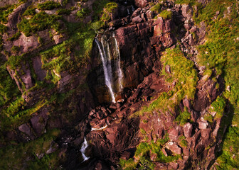 Fototapeta na wymiar Scenic waterfall in mountains