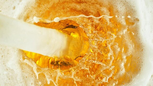 Super Slow Motion Shot of Pouring and Splashing Beer Background at 1000fps.