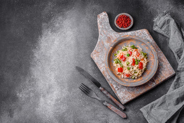 Delicious boiled rice with peppers, peas, asparagus beans and carrots