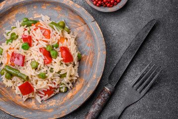 Delicious boiled rice with peppers, peas, asparagus beans and carrots