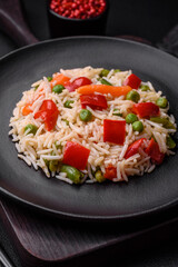 Delicious boiled rice with peppers, peas, asparagus beans and carrots