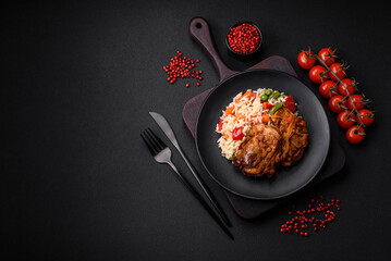 Delicious boiled rice with peppers, peas, asparagus beans and carrots and fried chicken