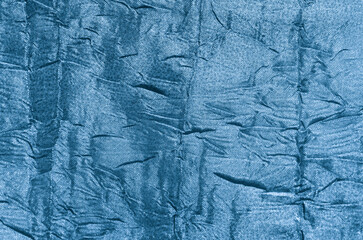 Texture of blue wrinkled fabric. wallpaper.