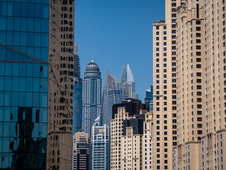 Fototapeta na wymiar Dubai Skyline scene of skyscrapers, apartments and holiday homes. Travel and Tourism concept piece 