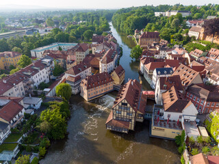 Fototapeta na wymiar Drone shot of a House on a river Regniz in Bamberg. Picturesqur place in the morning in Bavaria, Germany. Frankonia