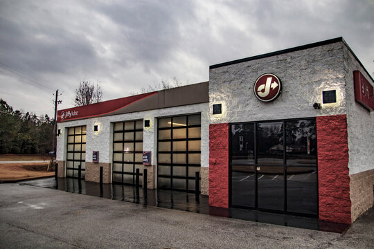 Jiffy Lube oil change retail store and cloudy skies