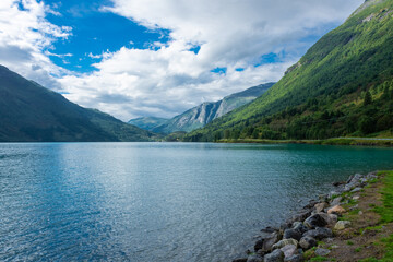 Naklejka na ściany i meble Landscape of the Lovatnet glacial lake with turquoise crystal clear water, Norway