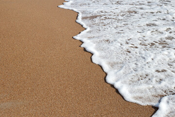 Sand and sea wave. Summer beach