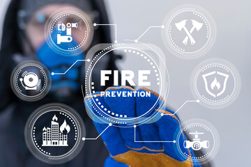 Firefighter or worker using virtual touch screen sees inscription: FIRE PREVENTION. Concept of fire...