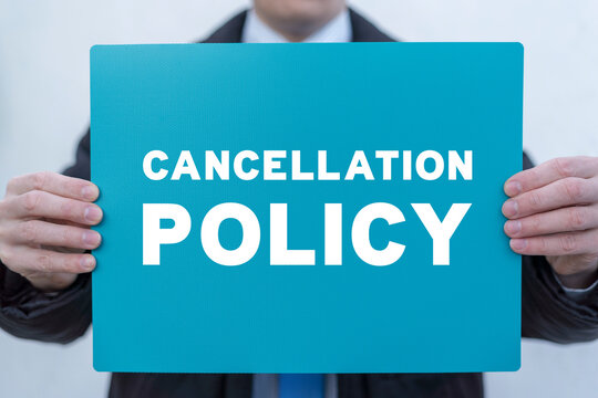 Businessman holding turquoise banner with inscription: CANCELLATION POLICY. Concept of business cancellation policy. Agreement Of Cancellation Policy.